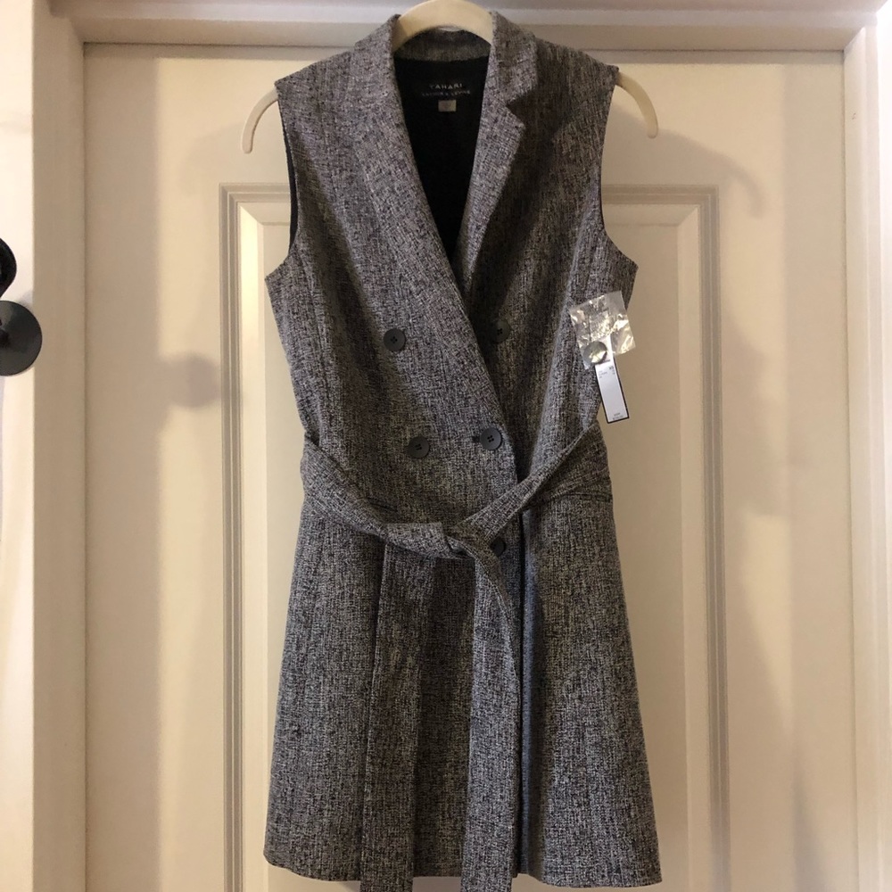 Sleeveless long vest/jacket.  Tie belt.